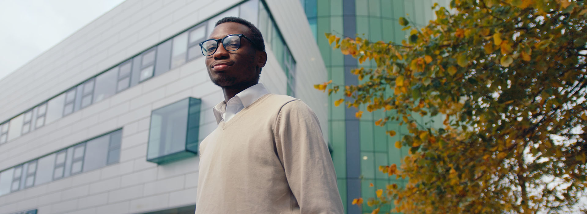 Person standing in front of the Sir Ian Wood Building on campus